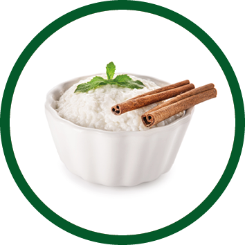 Delicious rice pudding with cinnamon in bowl on white background