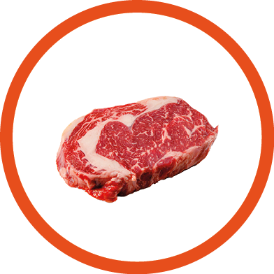 A rib eye steak of marbled grain-fed beef lies on a white background. Isolated.