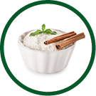Delicious rice pudding with cinnamon in bowl on white background