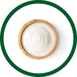 wood bowl of yogurt isolated on white background from top view