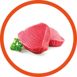 Fresh tuna fish fillet steaks garnished with parsley isolated on white background