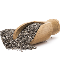 Pile or heap of chia seeds and a small wooden scoop seen from the front and isolated on white background