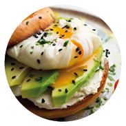 Toasted baggel with cream cheese, avocado, organic cherry tomatoes and poached egg. Vegan brunch.