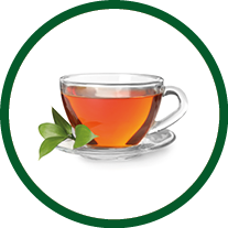 Glass cup of hot aromatic tea on white background