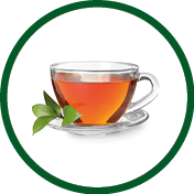 Glass cup of hot aromatic tea on white background