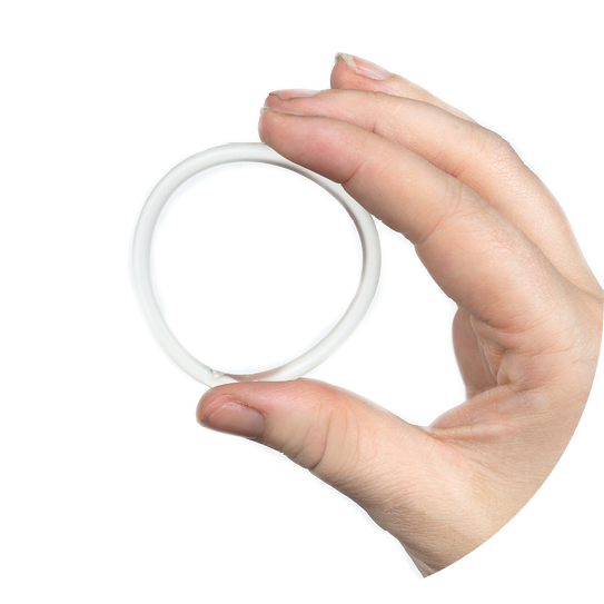 Birth control ring in a womans hand isolated on white background, vaginal ring for contraceptive use close-up