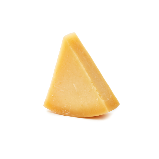 Piece of Parmesan cheese on white background