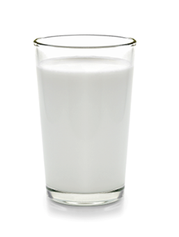 fresh milk in the glass on white background