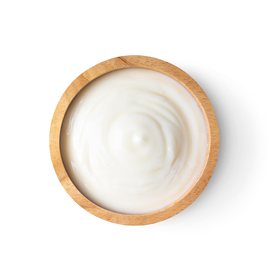 wood bowl of yogurt isolated on white background from top view