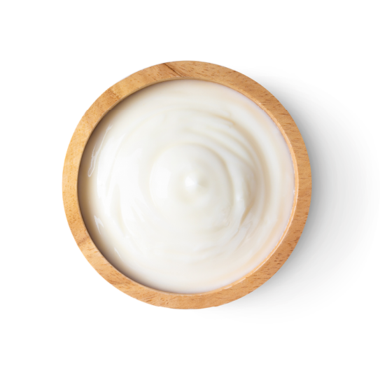 wood bowl of yogurt isolated on white background from top view