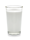 fresh milk in the glass on white background