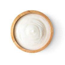 wood bowl of yogurt isolated on white background from top view