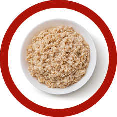 Bowl of oatmeal isolated on white background, healthy oat porridge breakfast, top view