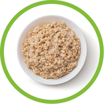 Bowl of oatmeal isolated on white background, healthy oat porridge breakfast, top view