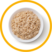 Bowl of oatmeal isolated on white background, healthy oat porridge breakfast, top view