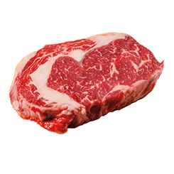 A rib eye steak of marbled grain-fed beef lies on a white background. Isolated.