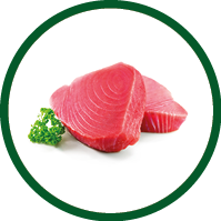 Fresh tuna fish fillet steaks garnished with parsley isolated on white background