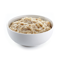 Bowl of oats porridge on a white background