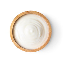 wood bowl of yogurt isolated on white background from top view