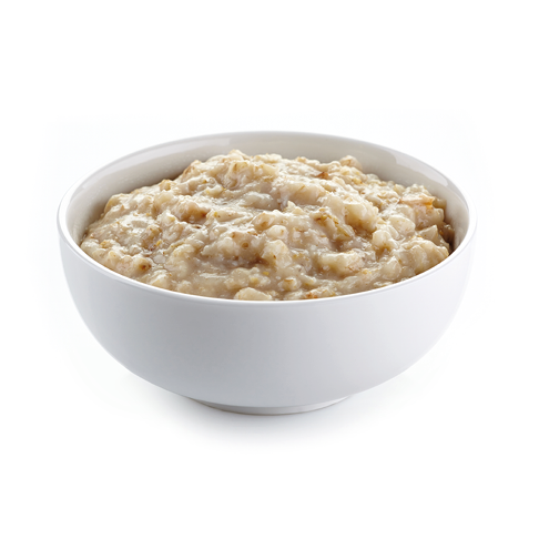 Bowl of oats porridge on a white background